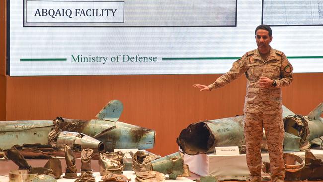 Saudi defence ministry spokesman Colonel Turki bin Saleh al-Malki displays pieces of what he said were Iranian cruise missiles and drones recovered from the attack site that targeted Saudi Aramco's facilities. Picture: AFP