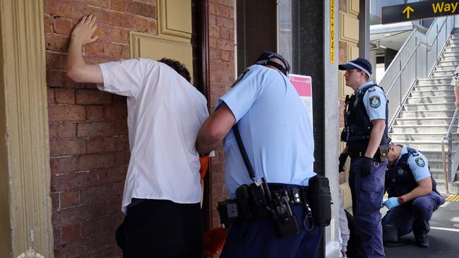 Police carry out a search on a man. Picture: NSW Police