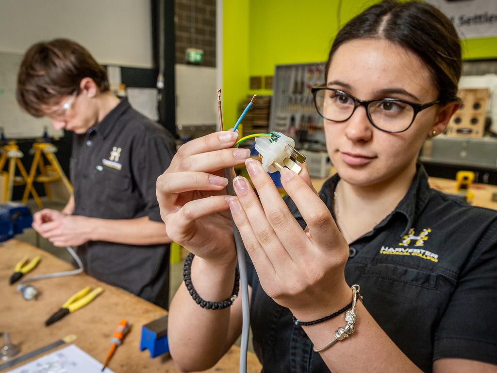 Year 12 student Lachlan and Year 11 student Amelia working in the electrical classroom. Picture: Jake Nowakowski