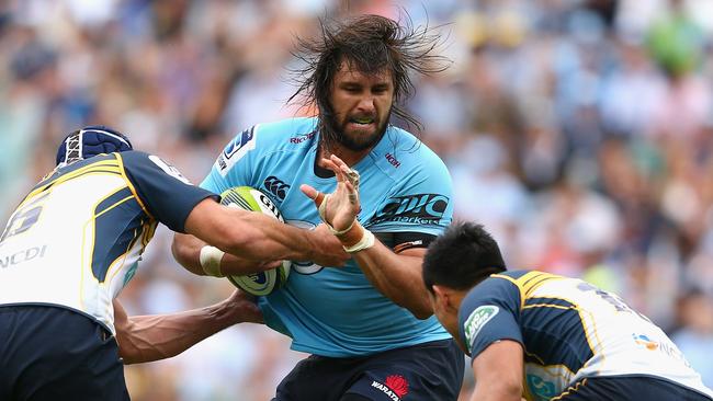 SYDNEY, AUSTRALIA - MARCH 22: Jacques Potgieter of the Waratahs is tackled during the round six Super Rugby match between the Waratahs and the Brumbies at Allianz Stadium on March 22, 2015 in Sydney, Australia. (Photo by Cameron Spencer/Getty Images)