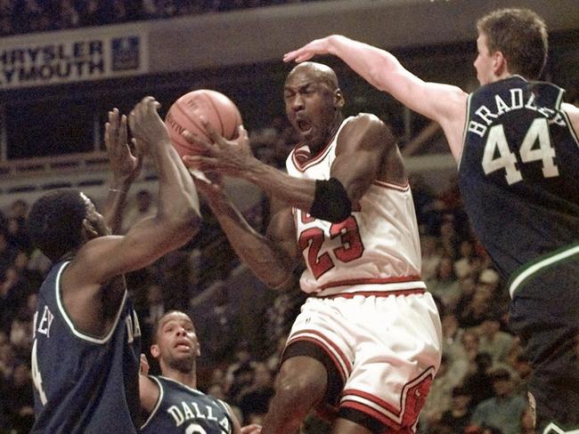 Bradley (right) attempts to stop Michael Jordan. (AP Photo/Fred Jewell). Basketball