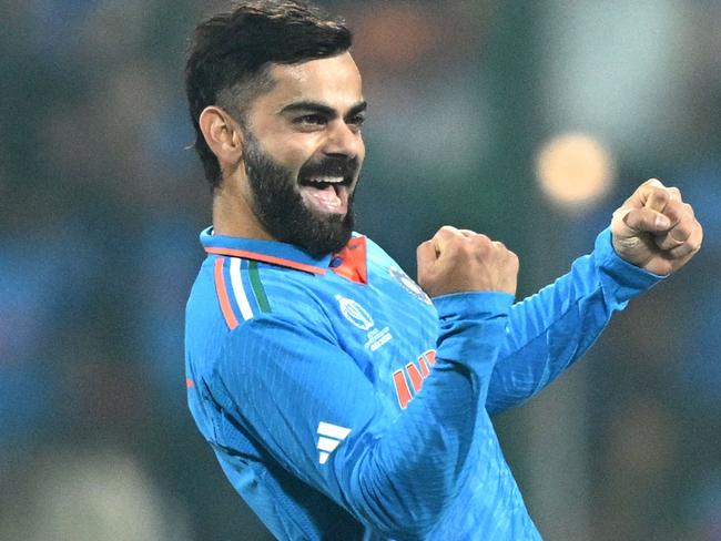 India's Virat Kohli celebrates after taking the wicket of Netherlands' captain Scott Edwards during the 2023 ICC Men's Cricket World Cup one-day international (ODI) match between India and Netherlands at the M. Chinnaswamy Stadium in Bengaluru on November 12, 2023. (Photo by R.Satish BABU / AFP) / -- IMAGE RESTRICTED TO EDITORIAL USE - STRICTLY NO COMMERCIAL USE --