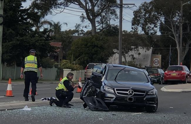 The woman who was driving the car lying near the car after the incident. Picture: Eliza Barr