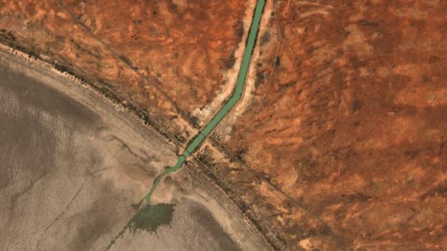 The NSW Government is letting water flow out onto the dry Menindee Lake bed, losing at least 100GL to dead storage.