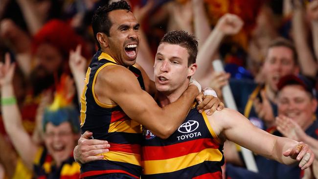 ADELAIDE, AUSTRALIA - SEPTEMBER 22: Josh Jenkins of the Crows (right) celebrates a goal with Eddie Betts of the Crows during the 2017 AFL First Preliminary Final match between the Adelaide Crows and the Geelong Cats at Adelaide Oval on September 22, 2017 in Adelaide, Australia. (Photo by Adam Trafford/AFL Media/Getty Images)