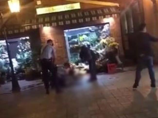 Video posted on social media shows the man run out of the florist towards police, before he is fatally shot. Picture: Twitter.