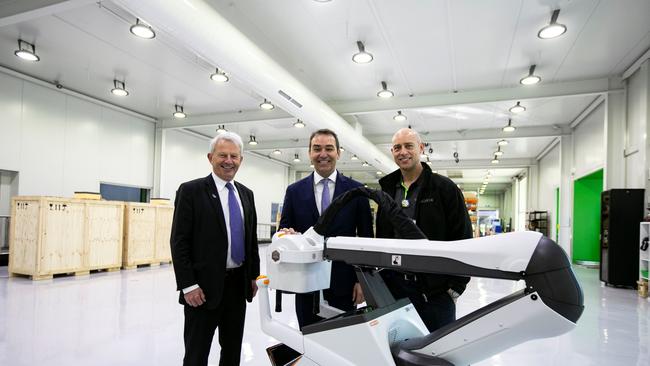 Micro-X chief executive Peter Rowland, left, with South Australian Premier Steven Marshall and Micro-X engineering head Anthony Skeats and the Carestream DRX Nano at its Tonsley, Adelaide, facility