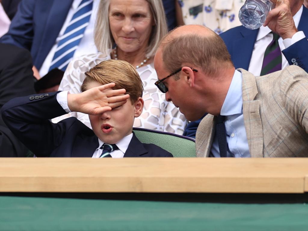 Prince William appears to complain about the heat in the stands. Picture: Getty Images