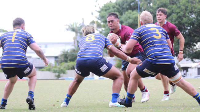 Rodney Blake running into a wall of Byron Murphy (left), PJ Su'a (centre) and Drew Smith (right).