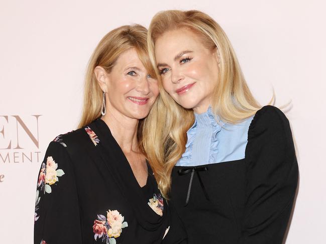 Actress Laura Dern cosied up to Nicole Kidman at the event. Picture: AFP