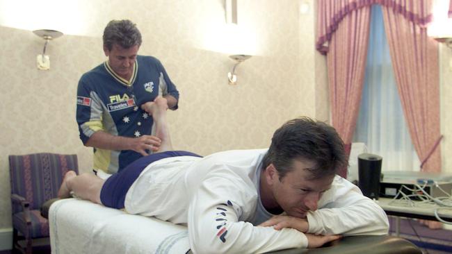 Mr Alcott treating then-Australian captain Steve Waugh on tour in the UK in 2001.