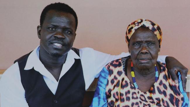 Former South Sudanese child soldier Ayik Chut with his late mother Achol Aguin Majok.