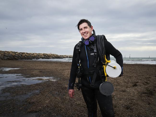 Marine Biologist, Dominic McAfee from University of Adelaide at Glenelg North, with an underwater speaker that plays marine sounds to attract shellfish and restore the native ecosystem, Thursday, Sept. 2, 2021. Picture: MATT LOXTON