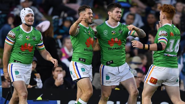 Aidan Sezer celebrates with Raiders teammates after scoring a try. Picture: AAP