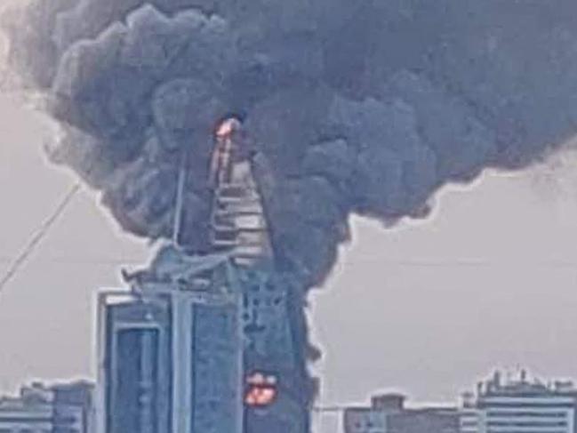 This picture taken on September 17, 2023 shows a raging fire at the Greater Nile Petroleum Oil Company Tower in Khartoum. Battles between the regular army and the paramilitary Rapid Support Forces, which intensified on September 17, had set fire to several key buildings in the centre of Sudan's capital. (Photo by AFP)