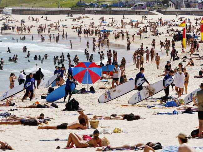 Thousands flock to the beach during the heatwave. Picture: Sam Ruttyn