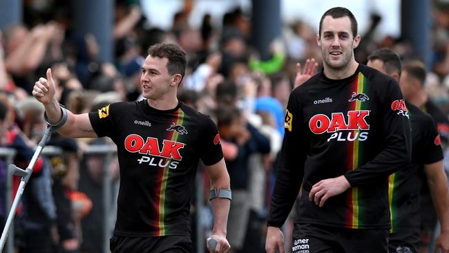 Dylan Edwards and Isaah Yeo greet fans during a Penrith Panthers training session at Sunshine Coast Stadium. Picture: Getty Images