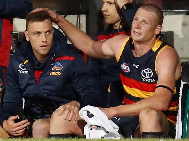 Brodie Smith of the Crows and an emotional Sam Jacobs embrace each other as the final siren sounds.