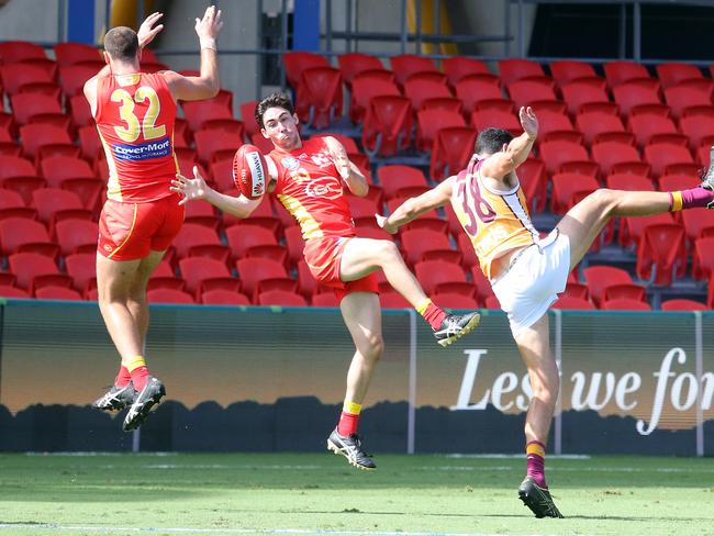 Round 4 NEAFL game between the Gold Coast Suns and Brisbane Lions at Metricon Stadium. Photo of Cory Beaman (Suns) and Connor Ballenden