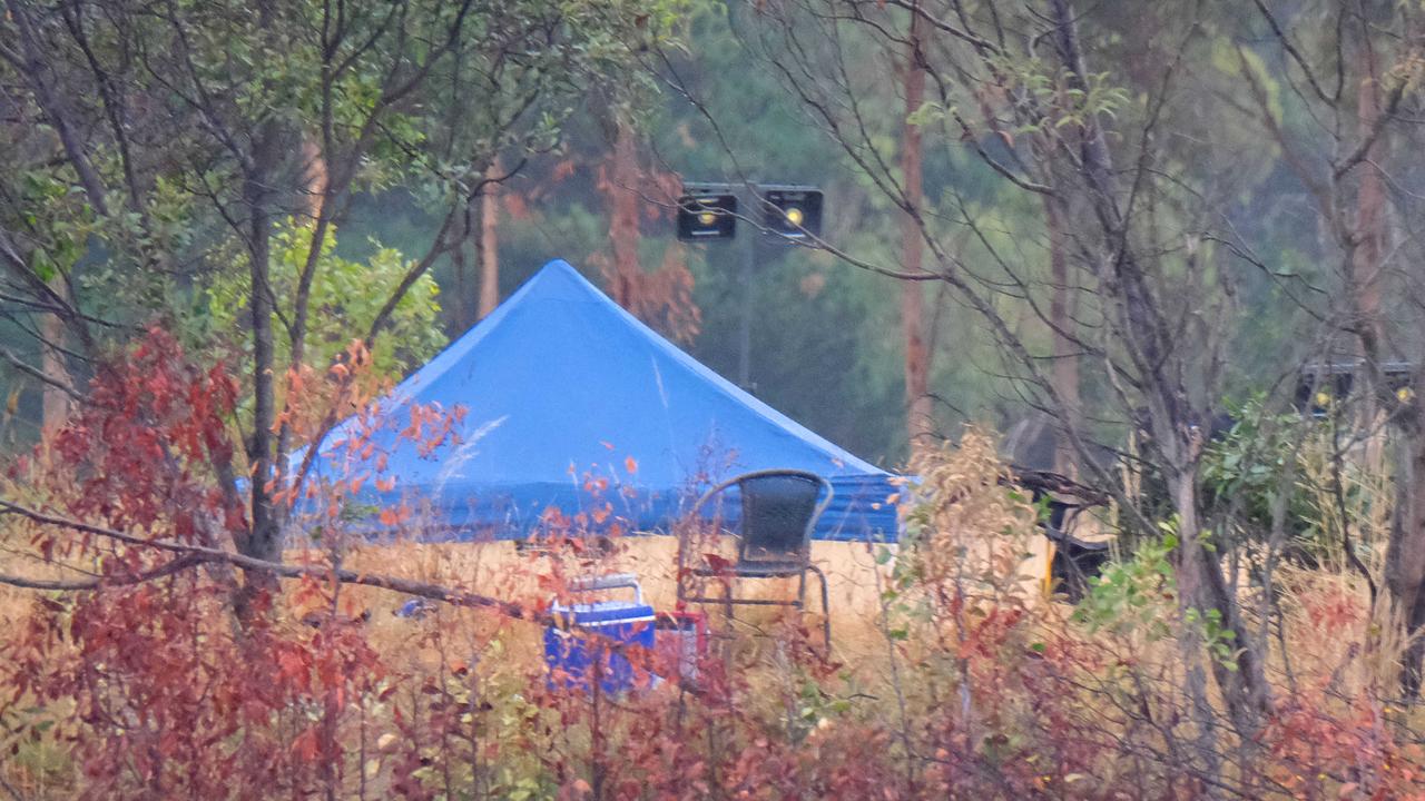 An empty chair and an esky sit in front of a police tent at the scene. Picture: Mark Wilson