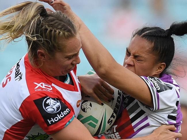 Langi Veainu of the Warriors is tackled by Kezie Apps of the Dragons during the NRL Women's Premiership match between the St George-Illawarra Dragons and the Warriors at ANZ Stadium in Sydney, Saturday, September 15, 2018. (AAP Image/Dan Himbrechts) NO ARCHIVING, EDITORIAL USE ONLY