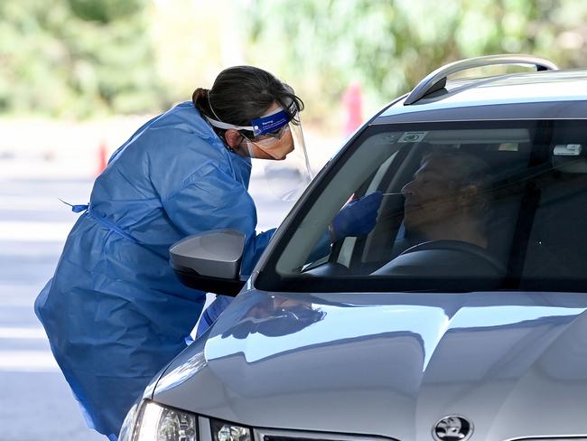 A health worker carries out a Covid-19 test at the Willoughby Leisure Centre in Sydney. Picture: NCA NewsWire/Bianca De Marchi