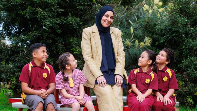 Chullora Public School principal Mrs Bahia Almir with students Iesha Sabour, 8, Life Fifita, 8, Yuqi Li, 8, and Marcus Holten, 9. Picture: Justin Lloyd