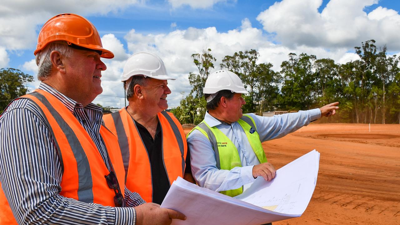 Forest Glen Centre Village board chair Tony Riddle board member and Whites IGA owner Michael White and Tomkins project manager Barry Lehmann meet on-site at the new shopping centre.