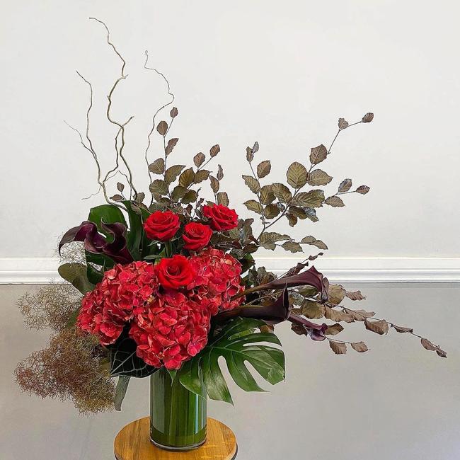 Red roses and hydrangeas exquisitely arranged by Stalks and Stems. Picture: Instagram @stalksandstemsbrisbane