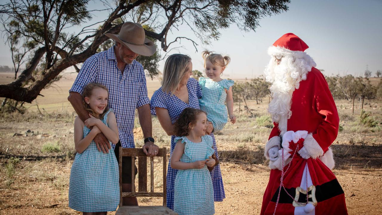 Santa Claus (Ken Gould of Port Pirie) visits grain farmer Andrew Walker, with wife Lydia and three children Elsie, Callie and Lucy at their Booleroo Centre property. Picture: Emma Brasier