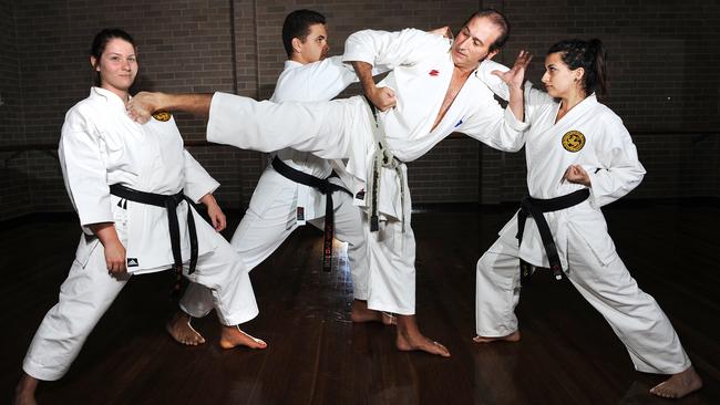 Paul Fenech (middle) is a karate instructor and Elvis impersonator. He is pictured with Lisa Tosello, 21, Joshua Fellew, 16, and Stephanie Fenech, 20. Picture: Jennifer Soo