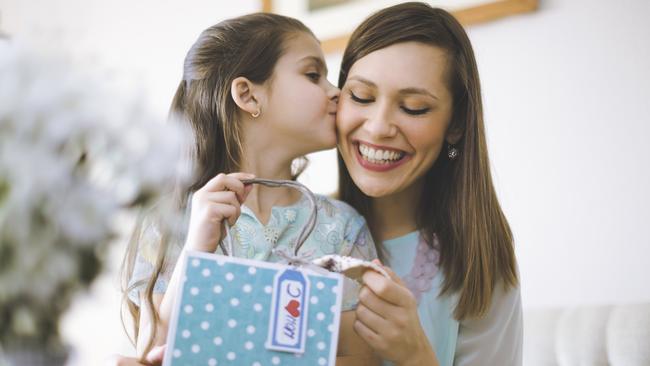 Happy mother posing with her daughter