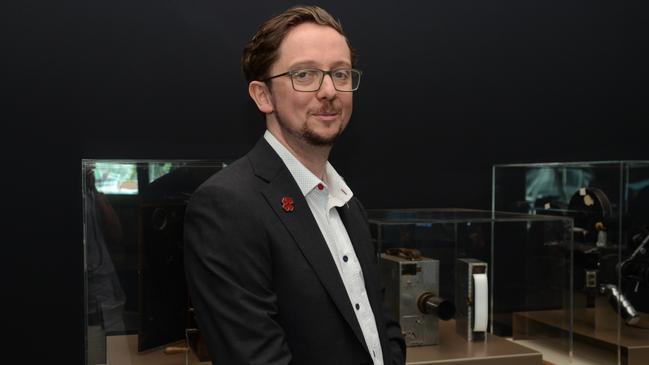 Australian War Memorial’s curator of photographs, film and sound Daniel Eisenberg with some of the old cameras used on war fronts. Picture: Supplied