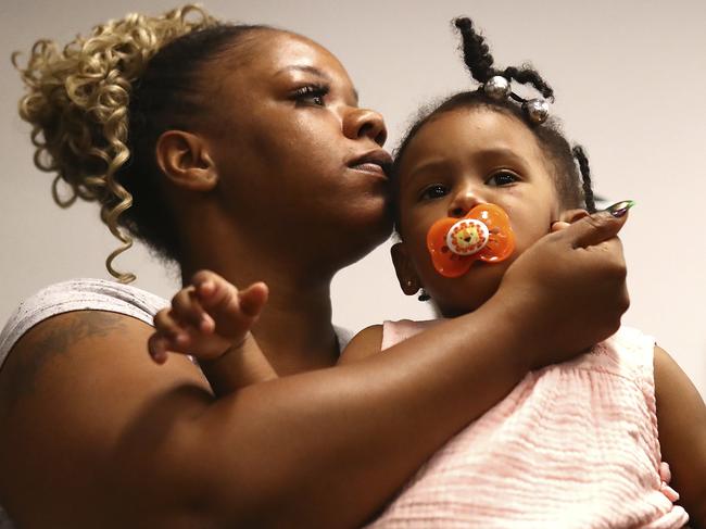 Tomika Miller, the wife of Rayshard Brooks, holds their daughter Memory, 2, during the family press conference in Atlanta. Picture: AP