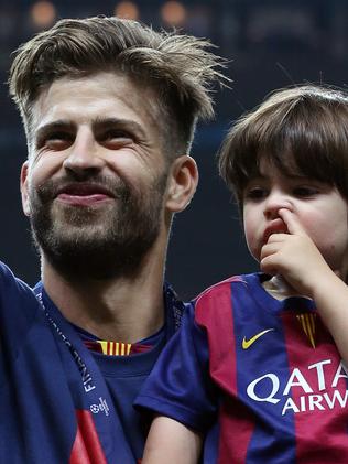 BERLIN, GERMANY - JUNE 6: Gerard Pique of Barcelona and his son Milan Pique Mebarak celebrate the victory after the UEFA Champions League Final between Juventus Turin and FC Barcelona at Olympiastadion on June 6, 2015 in Berlin, Germany. (Photo by Jean Catuffe/Getty Images)