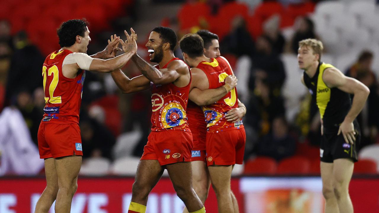 Gold Coast co-captain Touk Miller, pictured right celebrating with Izak Rankine, is desperate for his teammate to stay. Picture: Michael Klein