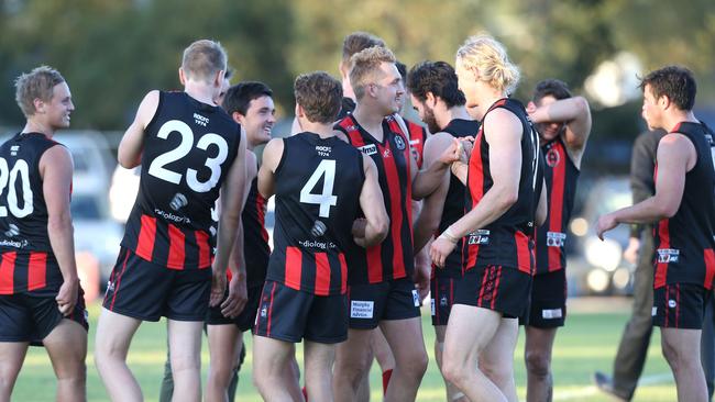 Rostrevor players celebrate their win against Salisbury North after the final siren. Picture: Stephen Laffer