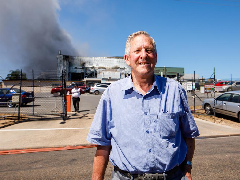 Thomas Foods International employee Barry Olson outside the smouldering facility. AAP Image/James Elsby