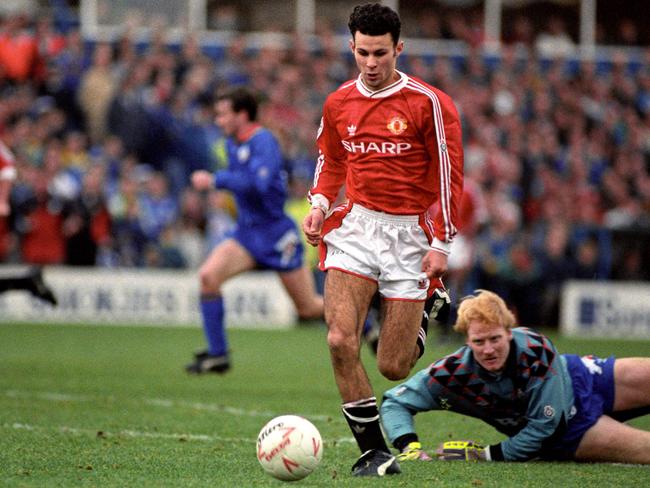 Giggs goes round Oldham Athletic goalkeeper Jon Hallworth to score his team's sixth goal in December 1991.