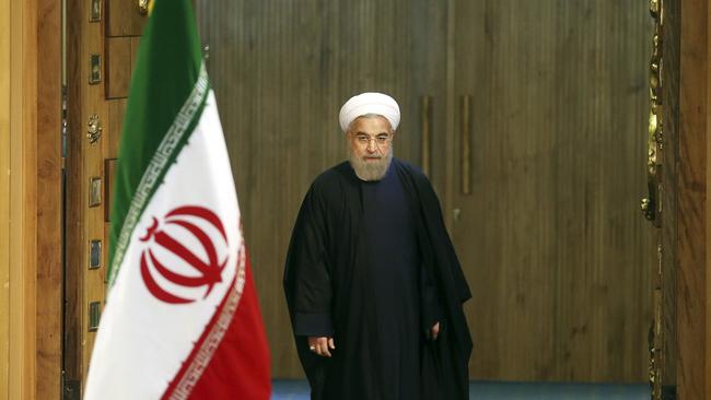 FILE - In this Sunday, Jan. 17, 2016 file photo, Iranian President Hassan Rouhani arrives for a news conference in Tehran, Iran. The end of nuclear-related sanctions and the flurry of diplomacy that led to the release of Americans held by Iran suggests a new era could be dawning in Tehran. That may well prove to be the case in time, both at home and abroad. But anyone hoping for rapid change is likely to be disappointed. (AP Photo/Ebrahim Noroozi, File)