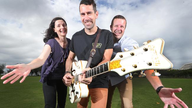 Reverend Catherine Solomon, musician Joe Riordan, and Juice 107.3 personality Hayden Whitworth tune up for the Easter United event at the Broadwater Parklands. Picture Glenn Hampson