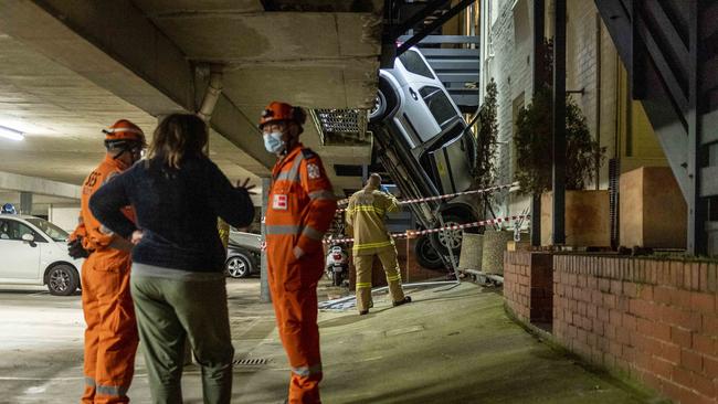 Emergency crews assess the damage. Picture: Jake Nowakowski