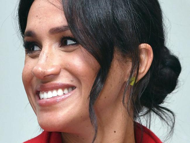 Meghan, Duchess of Sussex, arrives to open Number 7, a 'Feeding Birkenhead' citizens supermarket and community cafe with Britain's Prince Harry, at Pyramids Shopping Centre, as part of a visit to Birkenhead, northwest England, Monday Jan. 14, 2019. (Anthony Devlin/Pool via AP)