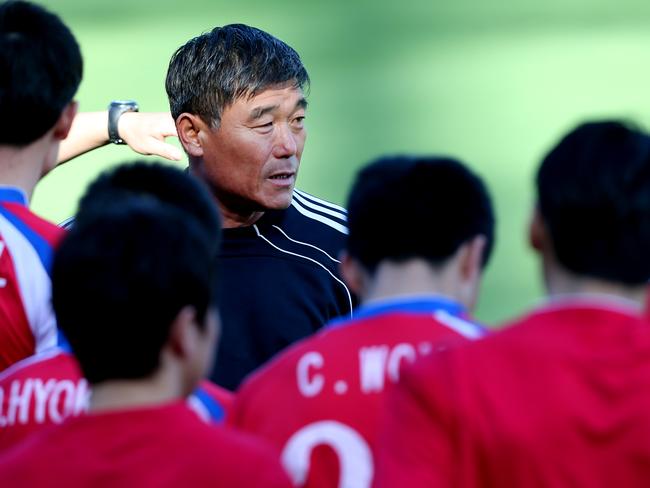 Pictured is coach Jo Tong Sop with players from the North Korea football team during a training session at Leichhardt Oval ahead of their opening Asian Cup match. Picture: Richard Dobson