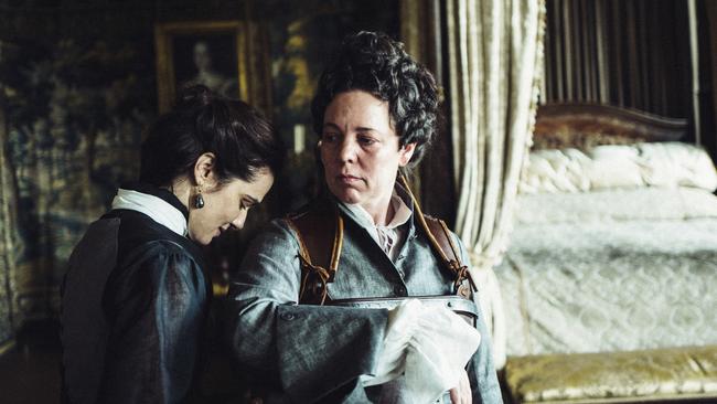 This image released by Fox Searchlight Films shows Rachel Weisz and Olivia Coleman, right, in a scene from the film "The Favourite." On Thursday, Dec. 6, 2018, Coleman was nominated for a Golden Globe award for lead actress in a motion picture comedy or musical for her role in the film. The 76th Golden Globe Awards will be held on Sunday, Jan. 6.  (Yorgos Lanthimos/Fox Searchlight Films via AP)