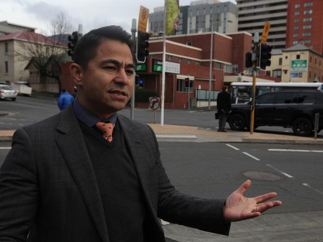 Project spokesman Quinten Villanueva with the Welcome Stranger hotel behind..