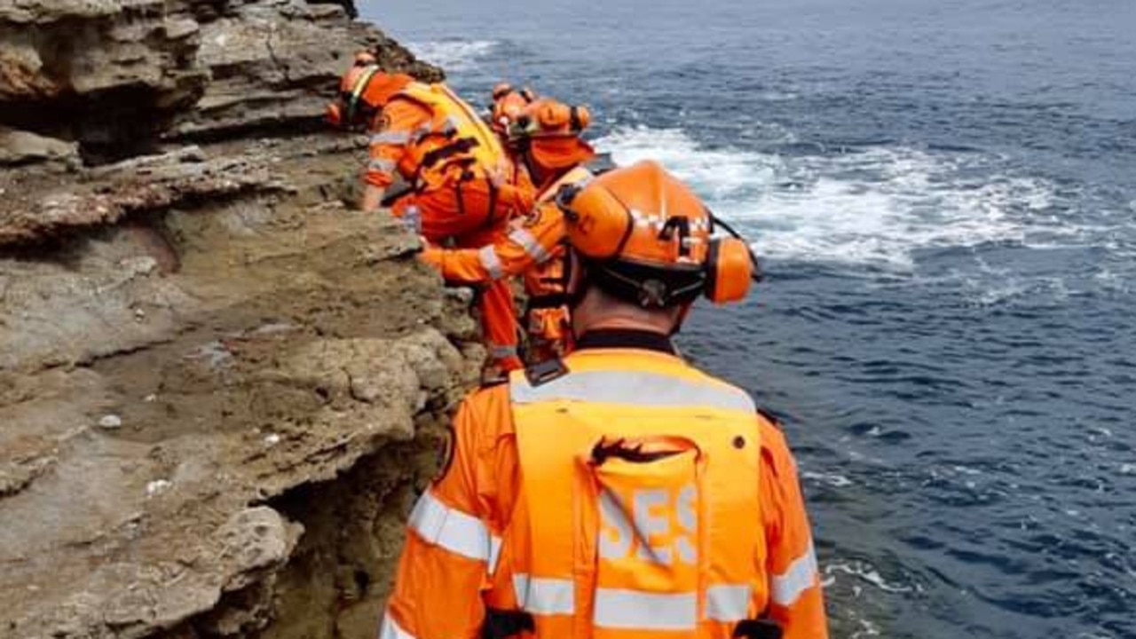 Emergency crews search the coast at Mollymook where a man’s torso was found.