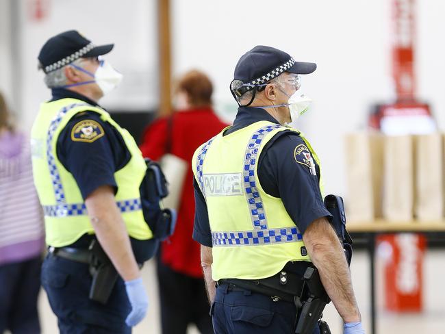 Security has been stepped up by Tasmania Police of arrivals at the Hobart Airport due to the coronavirus / COVID-19.  Bio security officers hand out bags of information / supplies as the pandemic hits hard.Picture: MATT THOMPSON