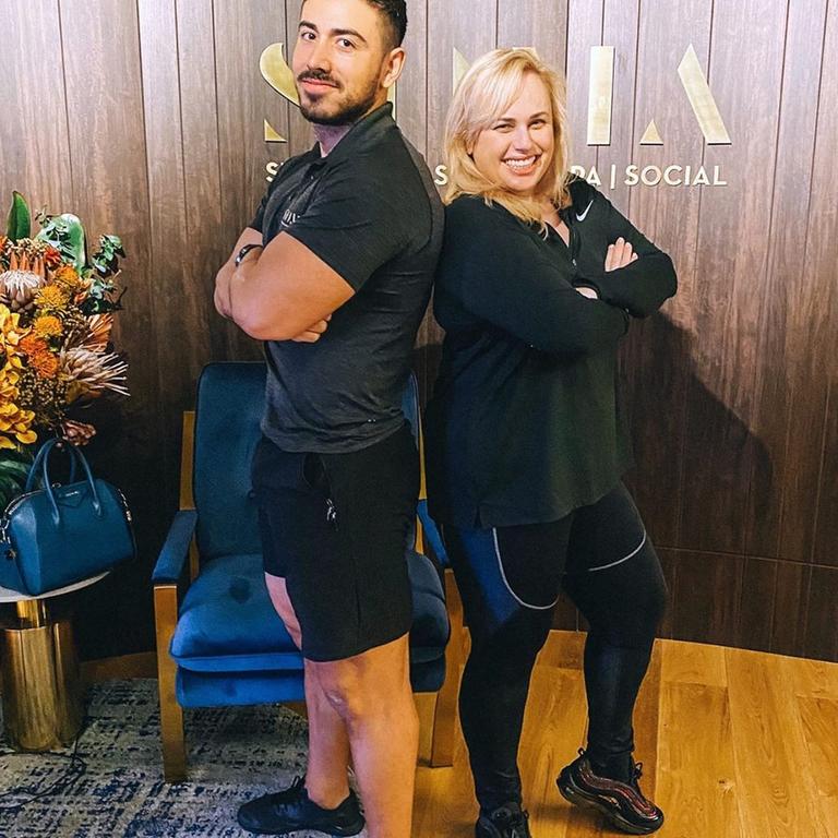 Sydney-based personal trainer Jono Castano together with one of his celebrity client’s Rebel Wilson. Picture: Instagram/JonoCastano