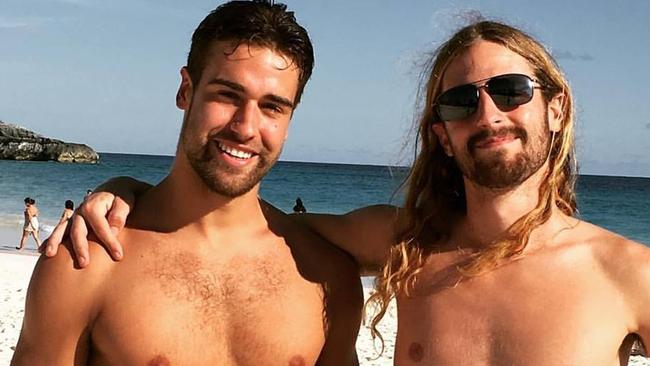 Endicott Ackerman, left, changed into board shorts before leaping into the ocean.